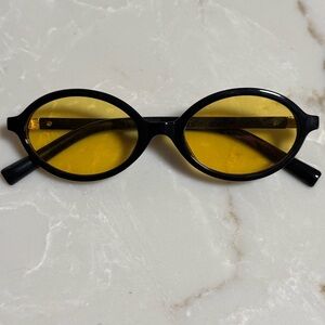Black Oval Sunglasses with Yellow Lenses